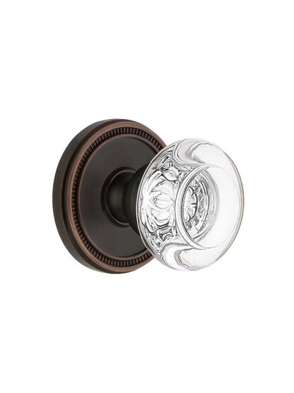 Grandeur Soleil Rosette Door Set with Bordeaux Crystal-Glass Knobs in Timeless Bronze.